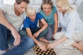 Portrait of a cute family playing chess Royalty Free Stock Photo