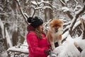 Portrait with a cute fluffy puppy. Winter walk with a dog. Royalty Free Stock Photo