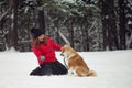 Portrait with a cute fluffy puppy. Winter walk with a dog. Royalty Free Stock Photo