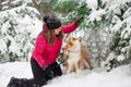 Portrait with a cute fluffy puppy. Winter walk with a dog. Royalty Free Stock Photo