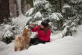 Portrait with a cute fluffy puppy. Winter walk with a dog. Royalty Free Stock Photo