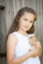 Portrait of a cute girl with adorable rabbit