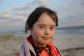 Portrait of a cute girl in the background of the sea