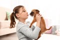 Portrait of cute girl with funny Brussels Griffon dog. Loyal friends