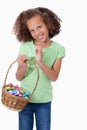 Portrait of a cute girl holding a basket full of Easter eggs Royalty Free Stock Photo