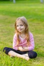 Portrait of a cute girl with long blond hair Royalty Free Stock Photo