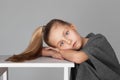 Portrait of a cute girl with long hair in the photostudio