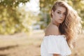 Portrait of a cute girl outdoors in a summer park Royalty Free Stock Photo