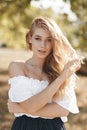 Portrait of a cute girl outdoors in a summer park Royalty Free Stock Photo