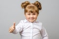 Portrait of cute girl showing thumbs up sign Royalty Free Stock Photo