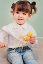 Portrait of cute happy baby girl playing with easter decorations Royalty Free Stock Photo