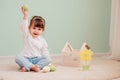 Portrait of cute happy baby girl playing with easter decorations Royalty Free Stock Photo
