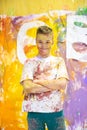 Portrait of a cute happy boy painting and having fun Royalty Free Stock Photo