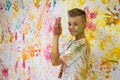 Portrait of a cute happy boy painting and having fun Royalty Free Stock Photo