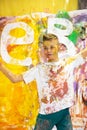 Portrait of a cute happy boy painting and having fun Royalty Free Stock Photo