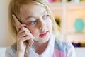 Portrait of cute happy girl using cell phone talking Royalty Free Stock Photo