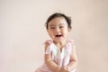 Portrait of cute happy little Asian baby girl who recently had baby tooth laughing and look at camera, baby expression concept Royalty Free Stock Photo