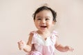 Portrait of cute happy little Asian baby girl who recently had baby tooth laughing and look at camera, baby expression concept Royalty Free Stock Photo