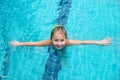 Portrait of cute happy little girl having fun in swimming pool.  Kids sport on family summer vacation. Active healthy holiday Royalty Free Stock Photo