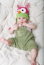 Portrait of cute happy 5 month old baby boy with funny hat. Royalty Free Stock Photo