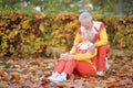 Portrait of happy senior couple in autumn park Royalty Free Stock Photo