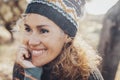 Portrait of cute happy and serene woman middle age smiling and looking in front of her enjoying time and outdoor leisure activity Royalty Free Stock Photo