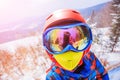 Cute skier boy in a winter ski resort. Royalty Free Stock Photo