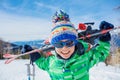 Cute skier boy in a winter ski resort. Royalty Free Stock Photo