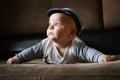 Portrait of cute infant boy lying on couch. Cute 4 month old baby. Infancy, babyhood concept.