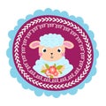 Portrait of a cute lamb with flowers in a decorative frame