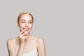 Portrait of cute laughing woman with healthy clear skin. Facial treatment, skincare and cosmetology concept Royalty Free Stock Photo