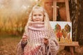 Portrait of a cute little artist girl. child draws autumn in the park Royalty Free Stock Photo