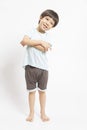 Cute little Asian boy with happy face, he laughing smiles and looking to camera on white background. Royalty Free Stock Photo