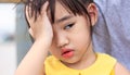 Portrait of cute Little asian girl,Children`s headache. Royalty Free Stock Photo