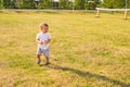 Portrait of cute little baby boy having fun outside. Smiling happy child playing outdoors Royalty Free Stock Photo