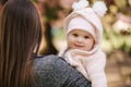 Portrait of cute little baby girl outside with mom. Beautiful girl smile. Five month baby. Happy family Royalty Free Stock Photo