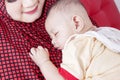 Cute little baby sleeping on her mother chest Royalty Free Stock Photo