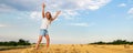 Portrait of cute little blond beautiful adorable cheerful caucasian kid girl enjoy sitting on hay stack or bale on Royalty Free Stock Photo