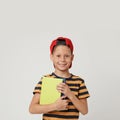 Portrait of cute little boy with books on background. Reading concept Royalty Free Stock Photo