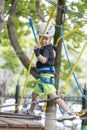 A little boy in a rope Park in the summer Royalty Free Stock Photo