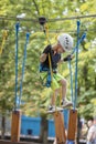 A little boy in a rope Park in the summer Royalty Free Stock Photo