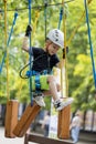 A little boy in a rope Park in the summer Royalty Free Stock Photo