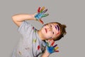 Portrait of a cute little boy messily playing with paints Royalty Free Stock Photo