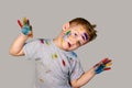 Portrait of a cute little boy messily playing with paints Royalty Free Stock Photo
