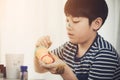 Portrait of a cute little boy messily playing with paints. Royalty Free Stock Photo