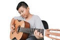 Cute boy playing acoustic guitar Royalty Free Stock Photo