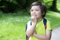 Portrait cute little boy putting his fingers in his mouth and looking at the camera with beautiful brown eyes, Excited kid carryin Royalty Free Stock Photo