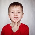 Portrait cute little Boy shows the First dropped-out milk Tooth Royalty Free Stock Photo