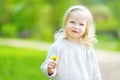 Portrait of cute little cheerful girl outdoors