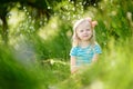 Portrait of cute little cheerful girl outdoors